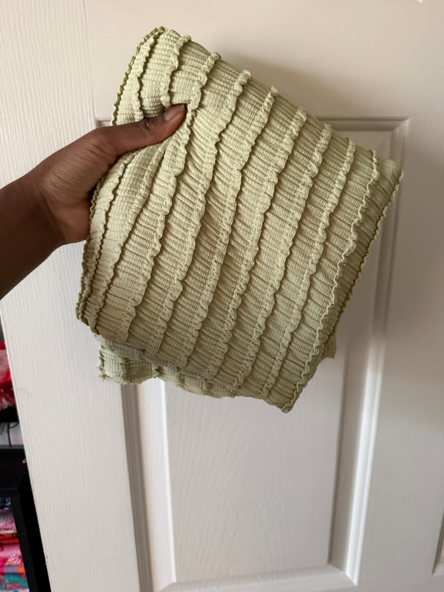 Dusty green ruffle knit fabric